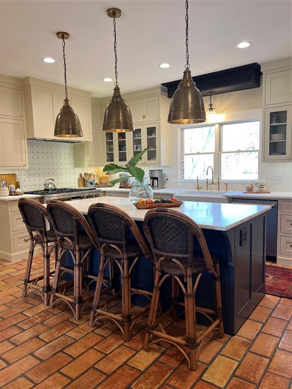 10200 North County Road Frisco, TX 75033 - Photo 12 of 25 a kitchen with a table chairs and white cabinets