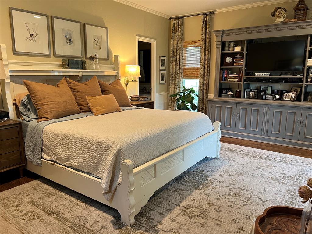 10200 North County Road Frisco, TX 75033 - Photo 18 of 25 a bedroom with a bed and a flat screen tv