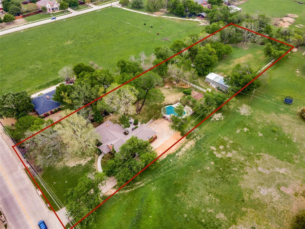 10200 North County Road Frisco, TX 75033 - Photo 2 of 25 a view of a garden with a lake