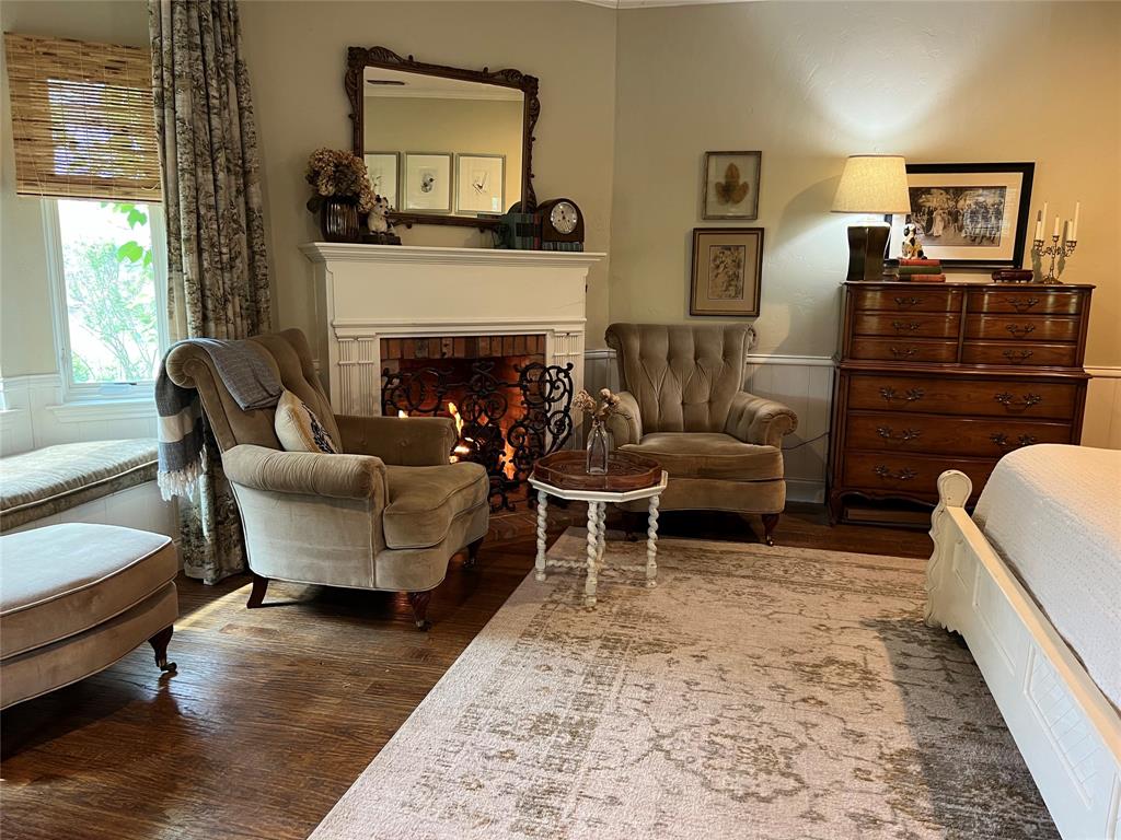 10200 North County Road Frisco, TX 75033 - Photo 21 of 25 a living room with furniture and a fireplace