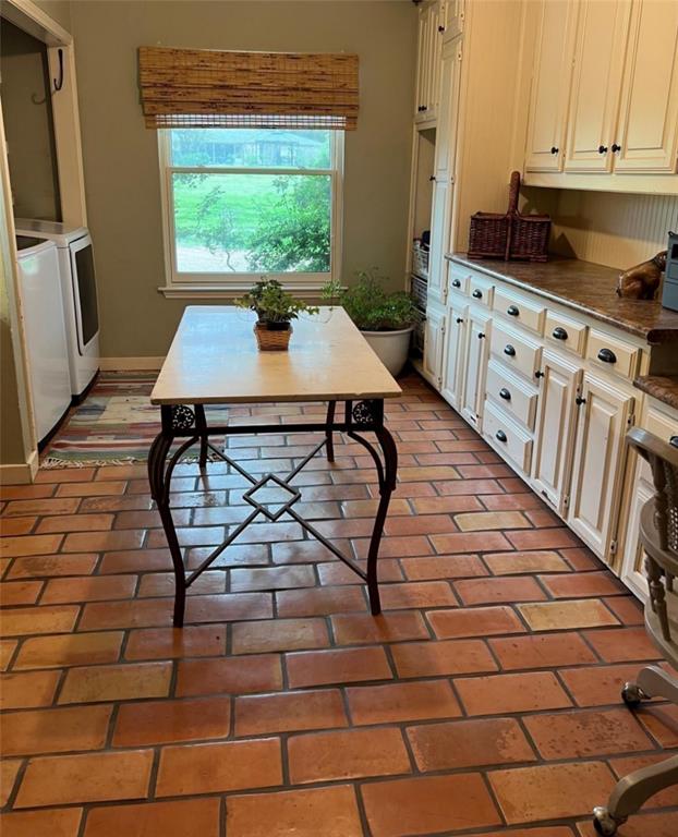 10200 North County Road Frisco, TX 75033 - Photo 22 of 25 a kitchen with granite countertop a stove a sink and a cabinets