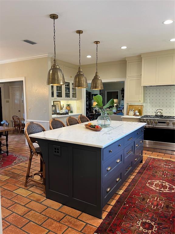 10200 North County Road Frisco, TX 75033 - Photo 5 of 25 a kitchen with stainless steel appliances a sink dishwasher a stove a microwave a counter top space and cabinets