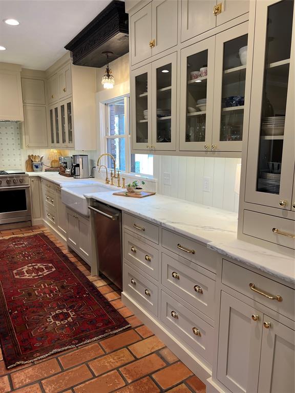 10200 North County Road Frisco, TX 75033 - Photo 7 of 25 a kitchen with stainless steel appliances granite countertop a sink and cabinets