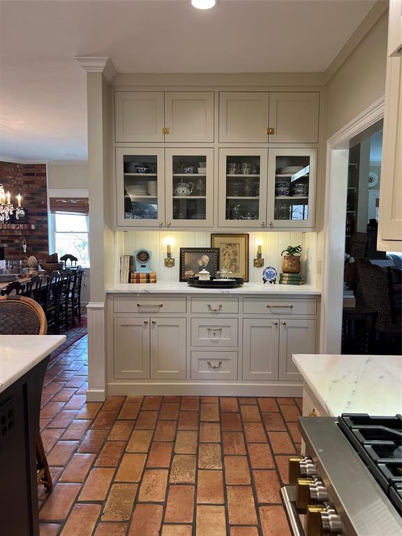 10200 North County Road Frisco, TX 75033 - Photo 10 of 25 a kitchen with stainless steel appliances a stove a sink and white cabinets