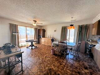 5820 South Skare Road Rochelle, IL 61068 - Photo 3 of 15 a living room with furniture a window and a flat screen tv