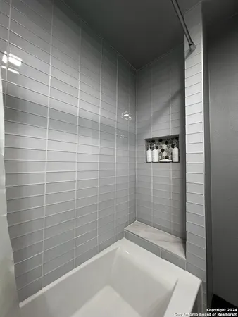 a bathroom with a toilet a sink and a mirror