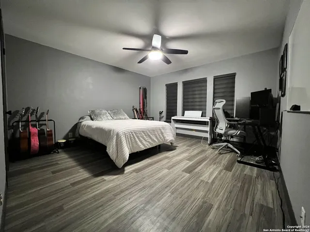 a bathroom with a shower and toilet