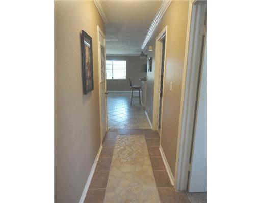 1917 Hidden Way Corpus Christi, TX 78412 - Photo 7 of 10 a view of a hallway with wooden floor