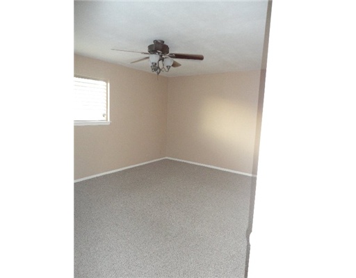 1917 Hidden Way Corpus Christi, TX 78412 - Photo 8 of 10 a view of an empty room with a window