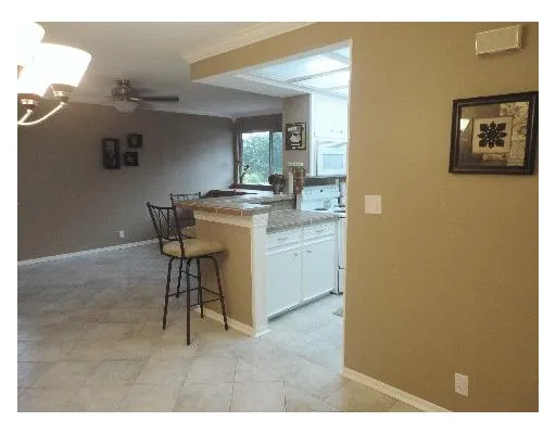 a view of a kitchen with furniture and a window