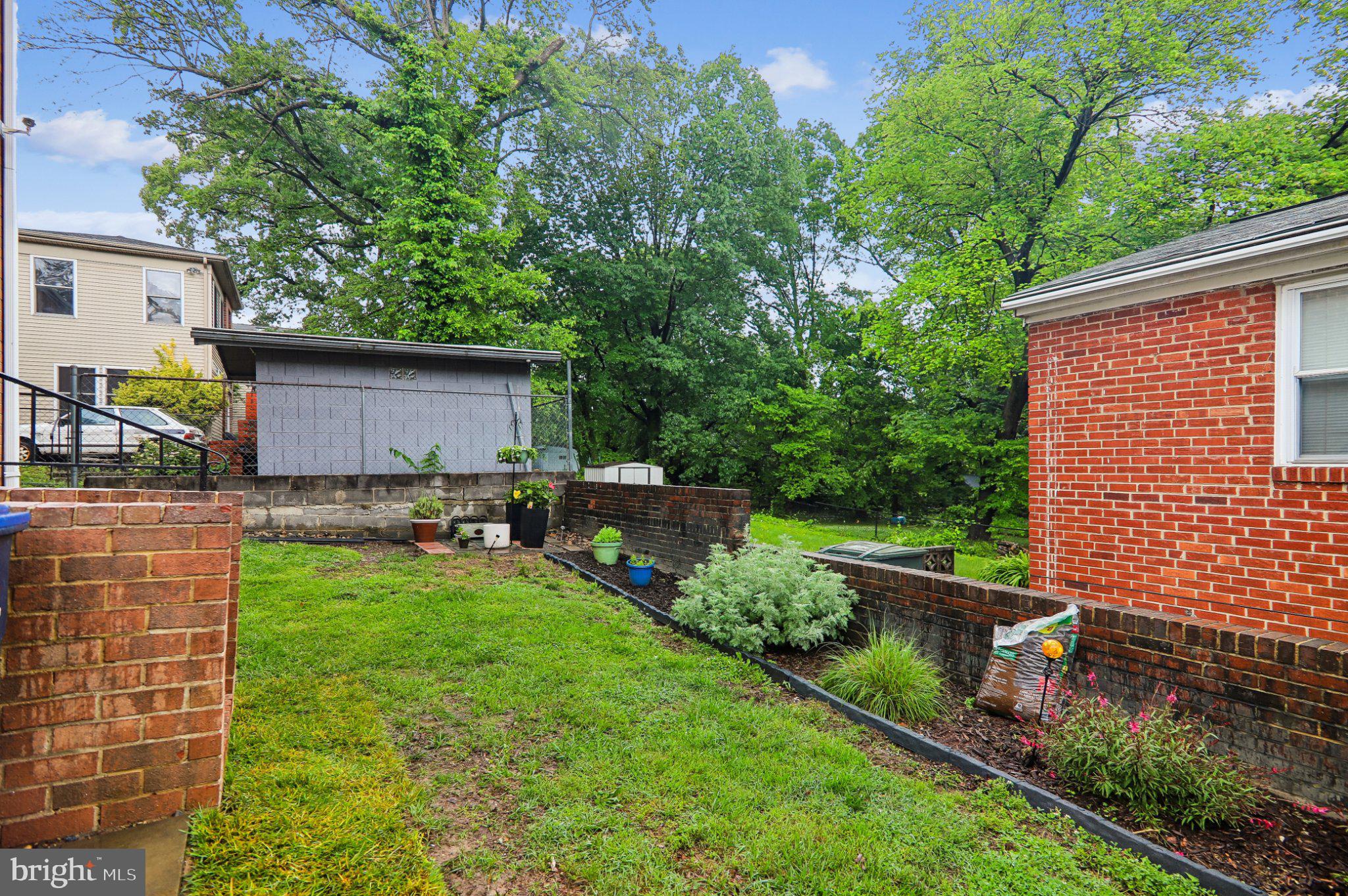 3103 Walnut Street Northeast Washington, DC 20018 - Photo 36 of 40 Lush backyard oasis with greenery.