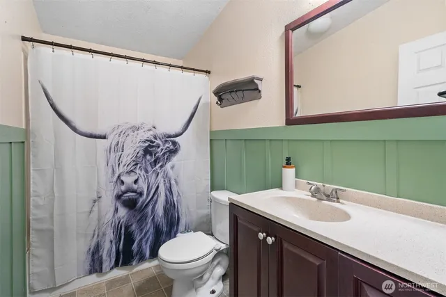 a wooden bench sitting in the middle of a yard