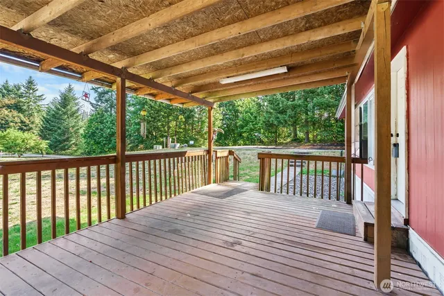 a balcony with wooden floor in outdoor space
