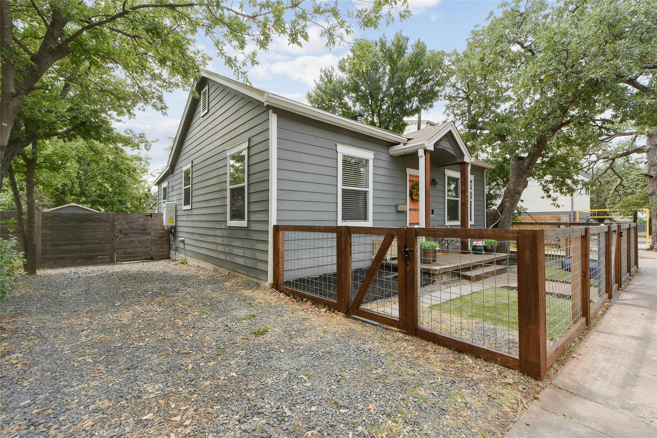 3403 King Street Austin, TX 78705 - Photo 2 of 29 a view of a house with wooden fence next to a road