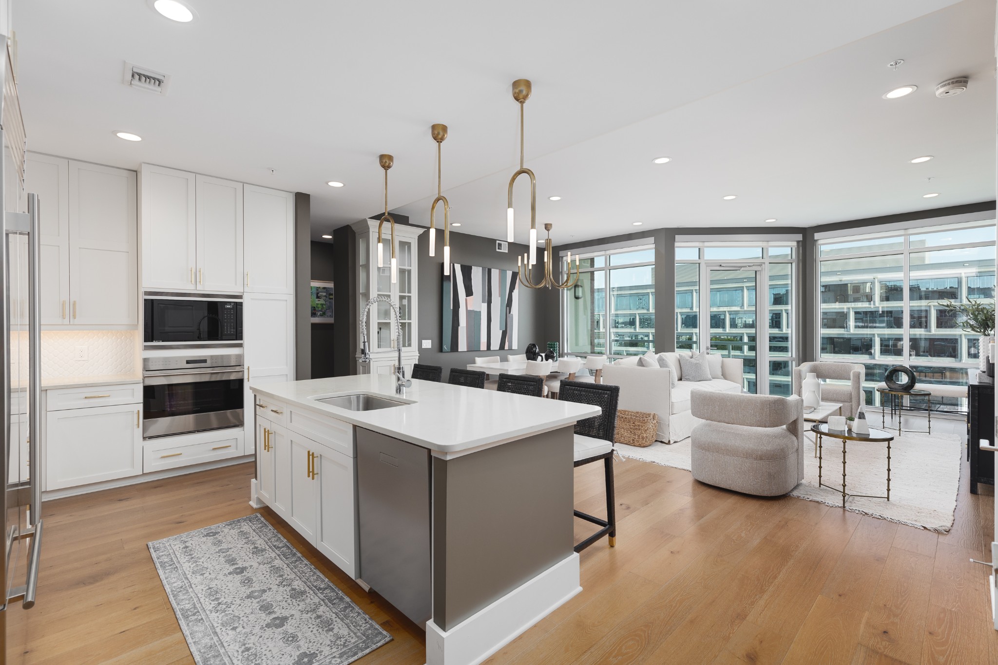 a large white kitchen with a large window