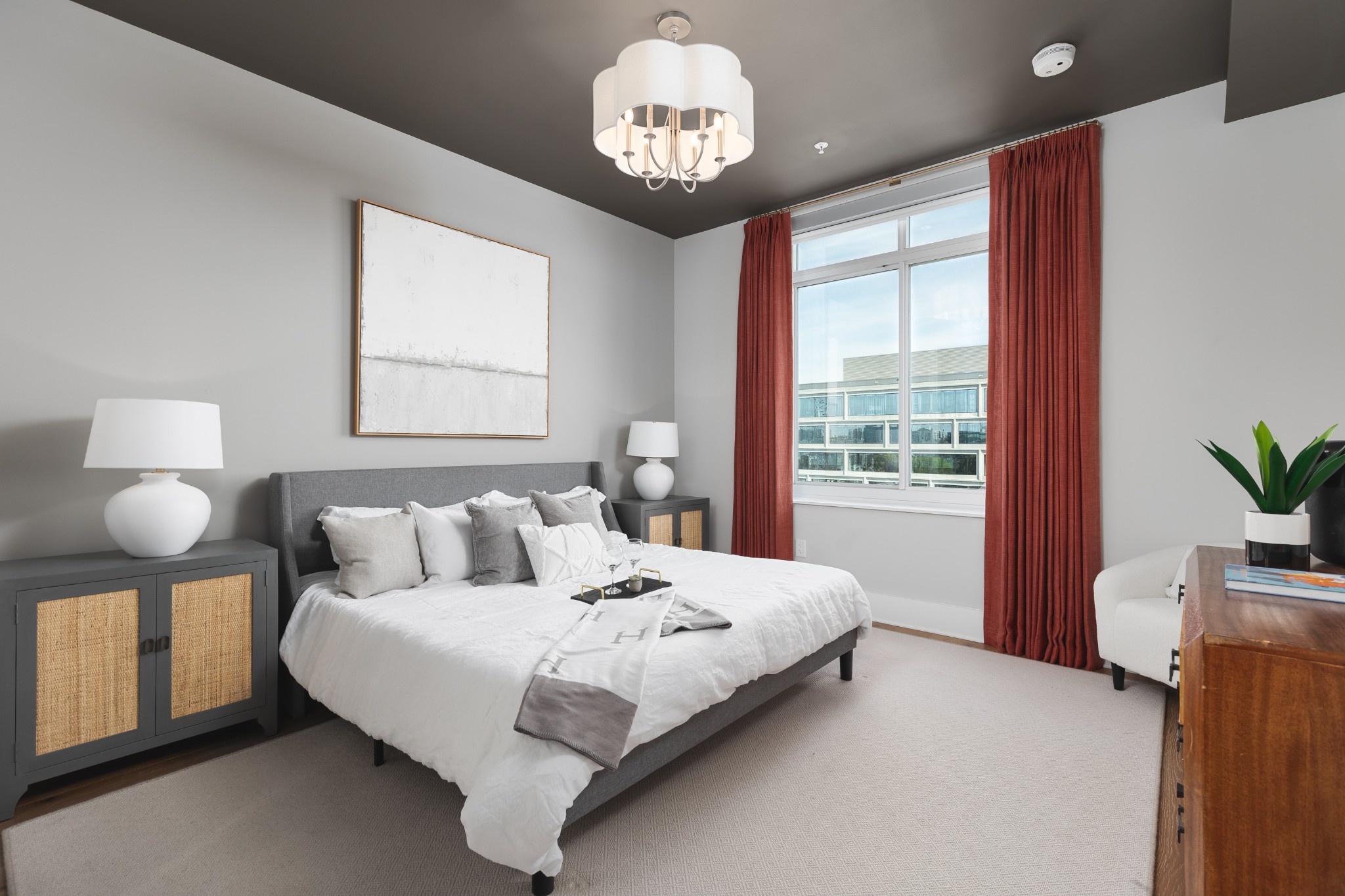 20 Rutledge Street, Unit 505 Nashville, TN 37210 - Photo 20 of 67 a bedroom with a bed and a chandelier