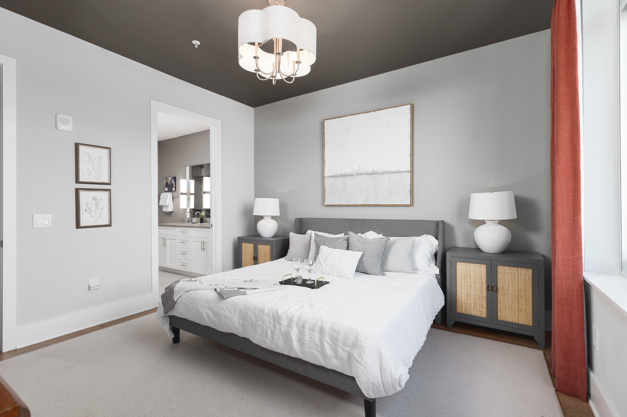 20 Rutledge Street, Unit 505 Nashville, TN 37210 - Photo 22 of 67 a bedroom with a bed and a chandelier