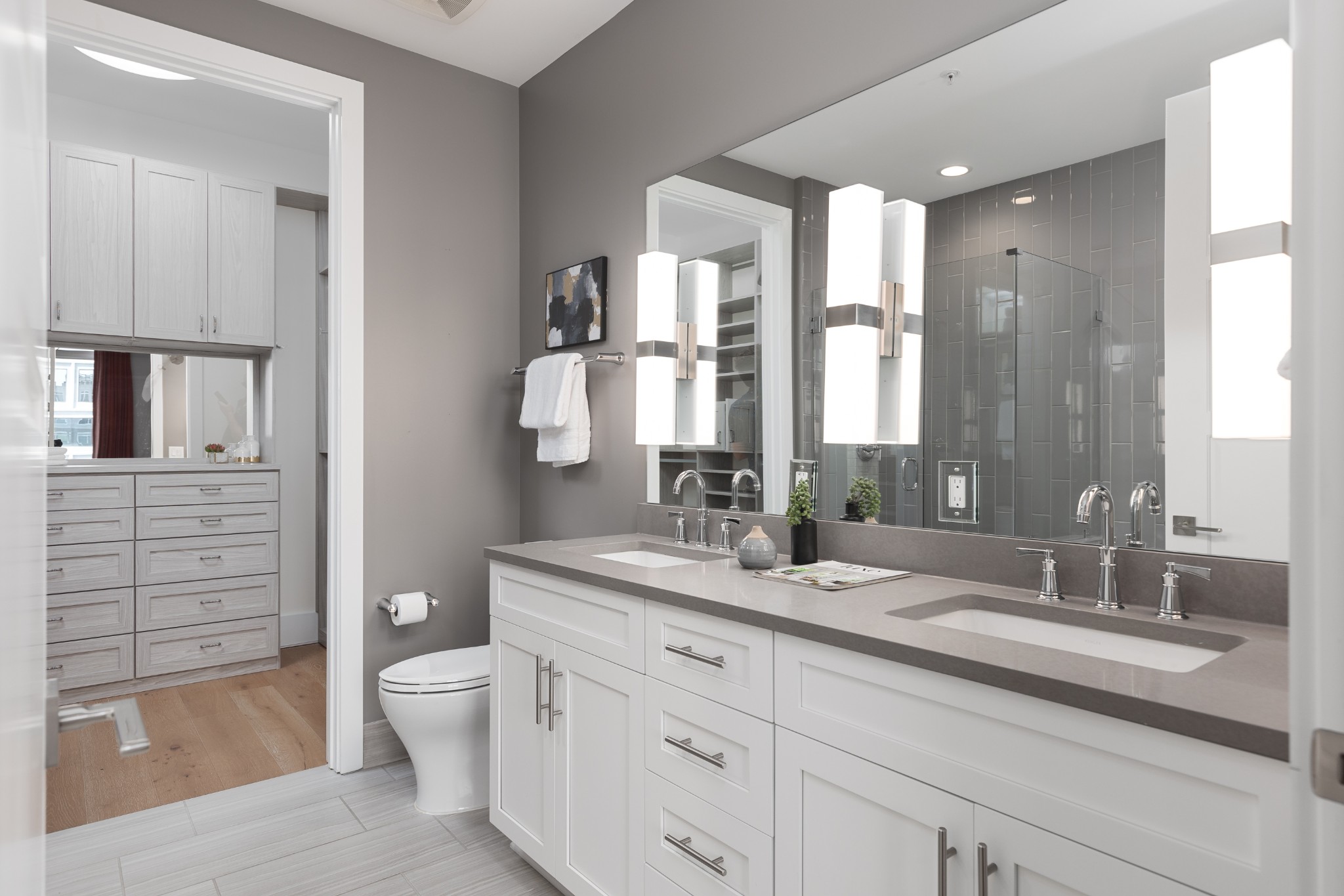 20 Rutledge Street, Unit 505 Nashville, TN 37210 - Photo 23 of 67 a bathroom with a granite countertop sink mirror vanity and toilet