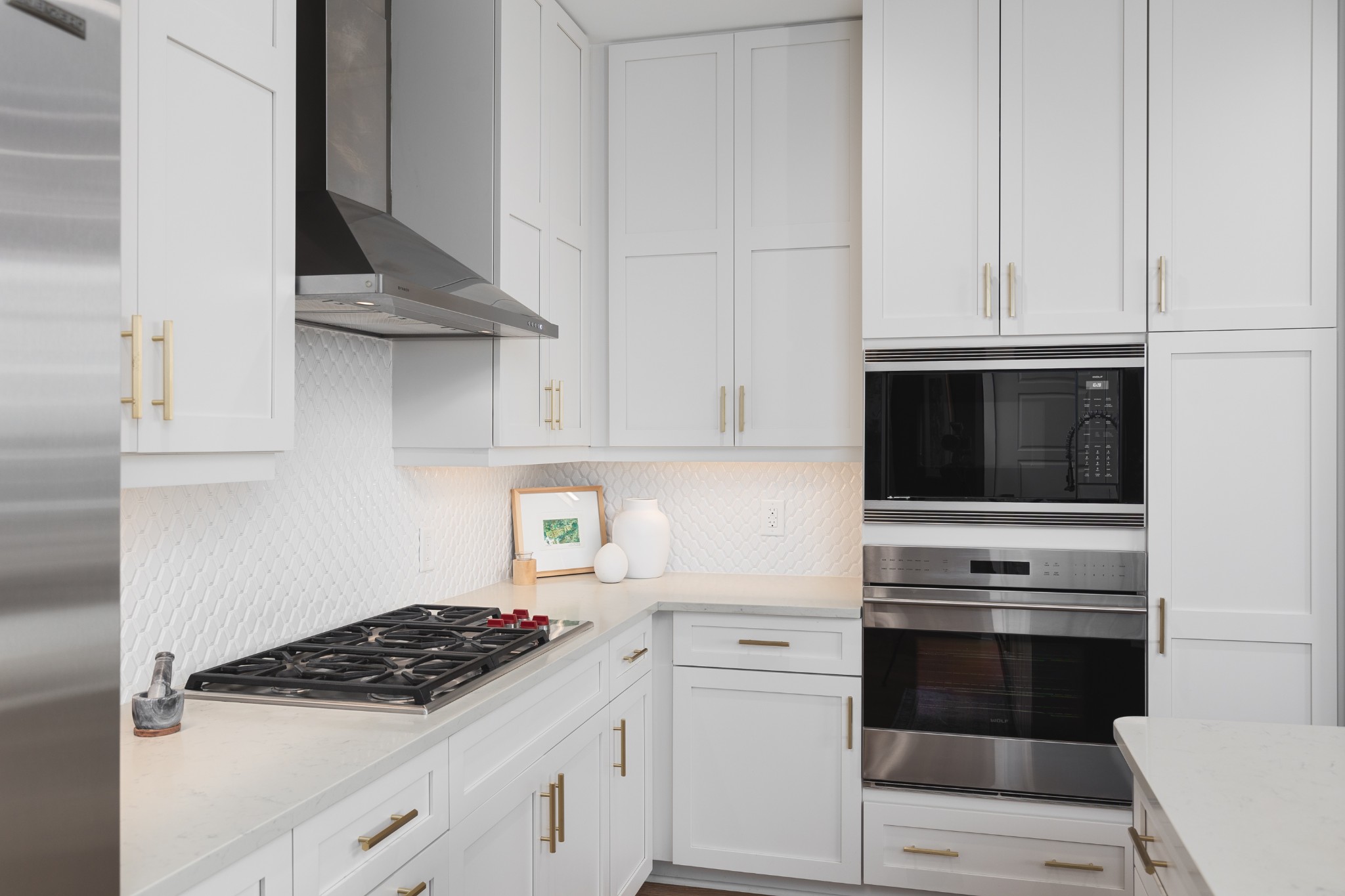 20 Rutledge Street, Unit 505 Nashville, TN 37210 - Photo 4 of 67 a kitchen with white cabinets and appliances