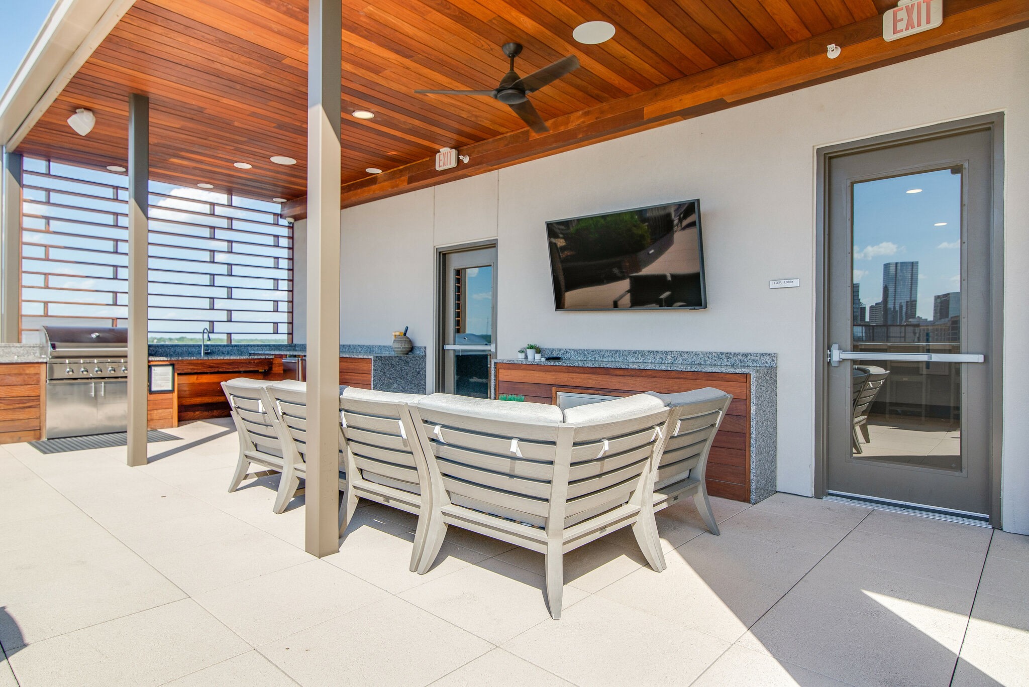 20 Rutledge Street, Unit 505 Nashville, TN 37210 - Photo 55 of 67 a living room with patio furniture and a flat screen tv