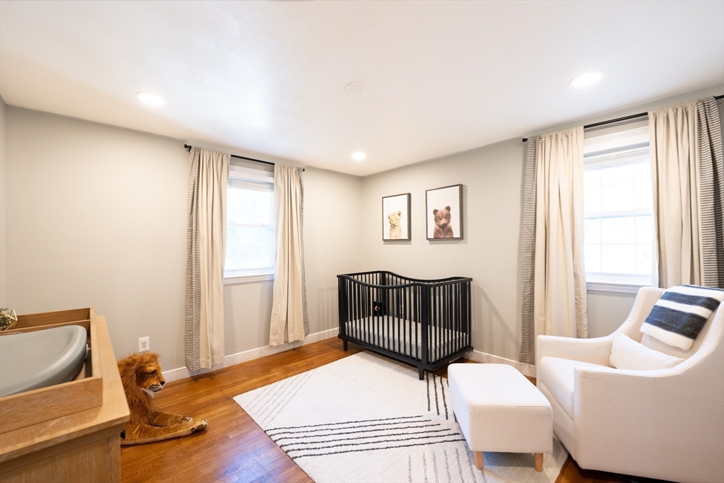 54 Chisholm Road Stoughton, MA 02072 - Photo 13 of 33 a bedroom with furniture and a window