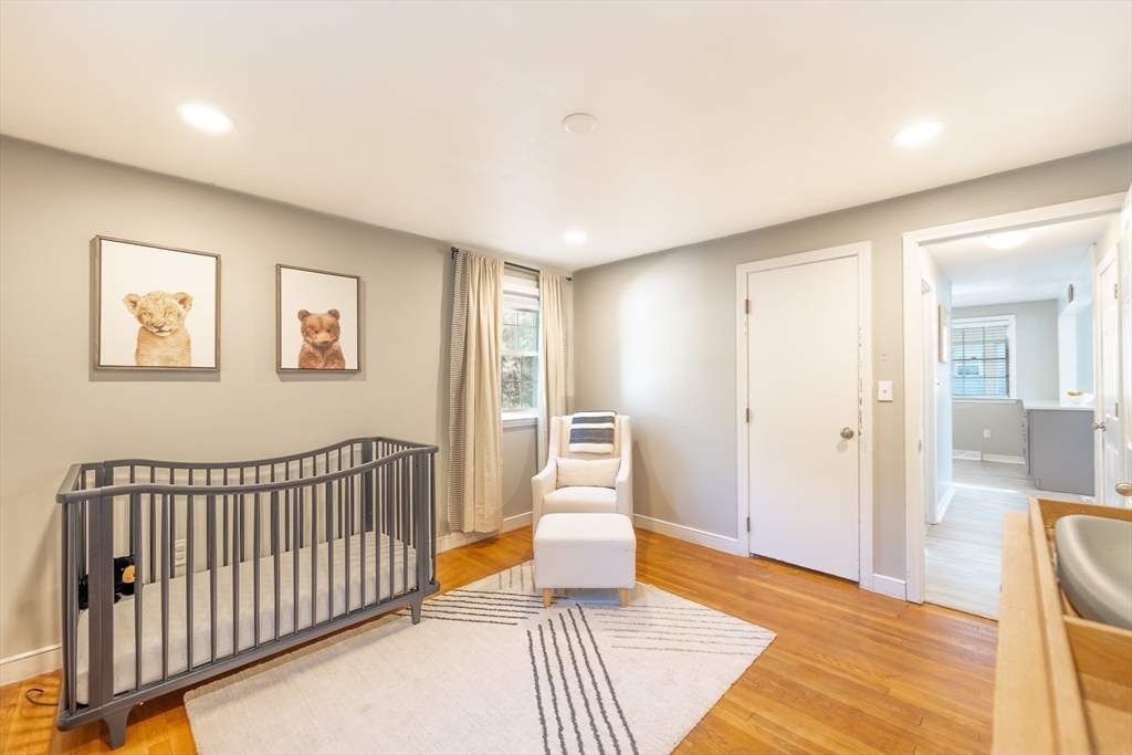 54 Chisholm Road Stoughton, MA 02072 - Photo 14 of 33 a view of a bedroom with wooden floor