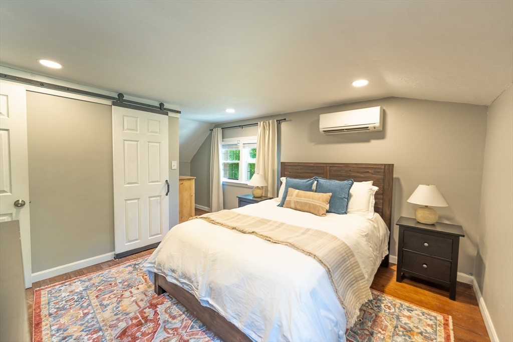 54 Chisholm Road Stoughton, MA 02072 - Photo 15 of 33 a spacious bedroom with a bed and a dresser