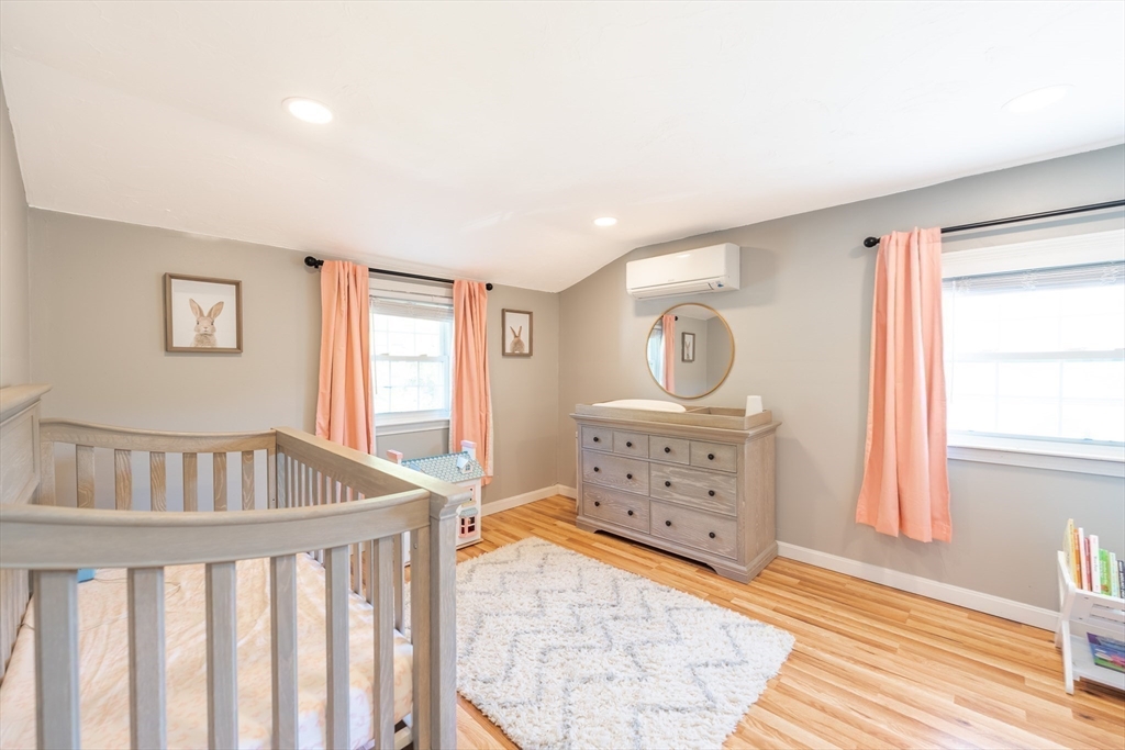 54 Chisholm Road Stoughton, MA 02072 - Photo 21 of 33 a bedroom with furniture and window