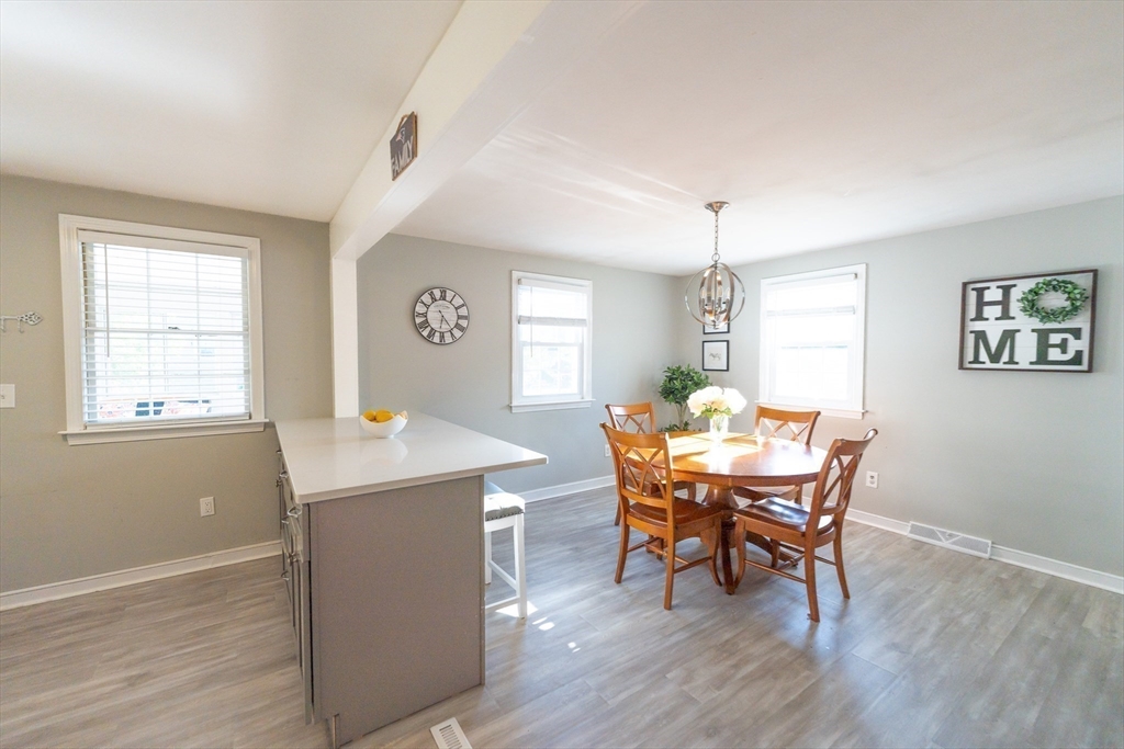 54 Chisholm Road Stoughton, MA 02072 - Photo 8 of 33 a view of a dining room with furniture and wooden floor