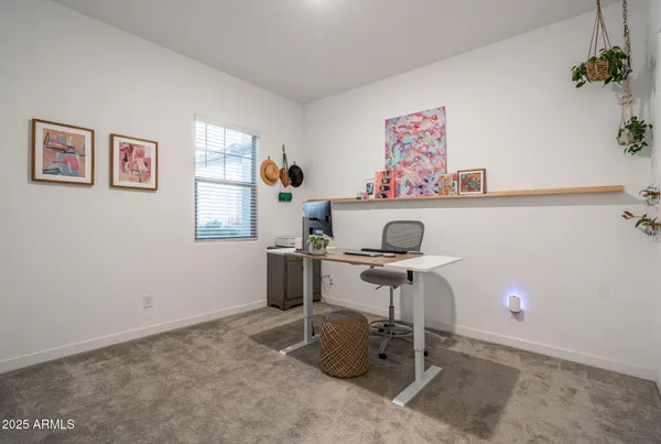 a utility room with cabinets washer and dryer