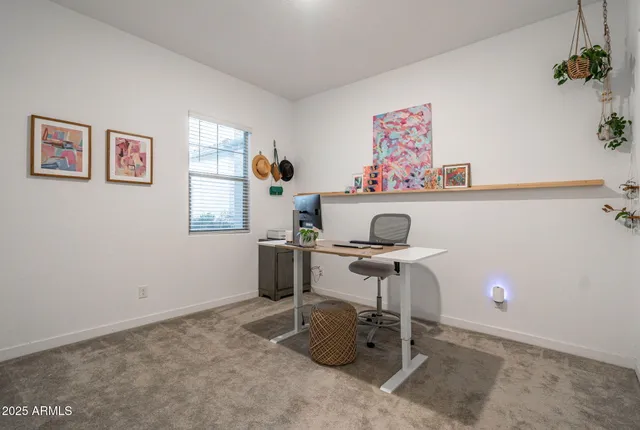 a utility room with cabinets washer and dryer