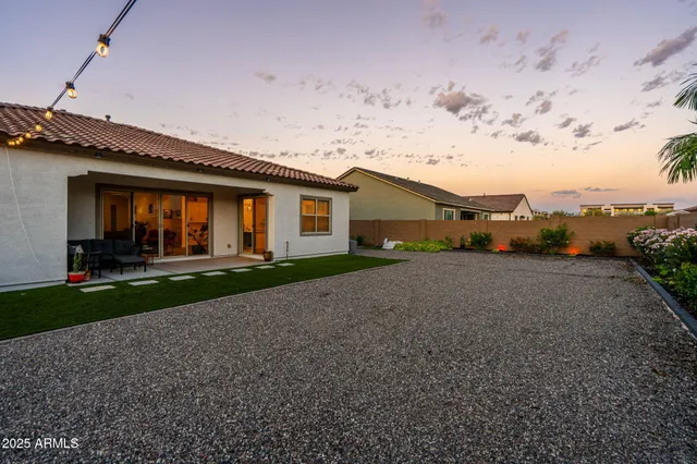 a living room with furniture oven and a potted plant