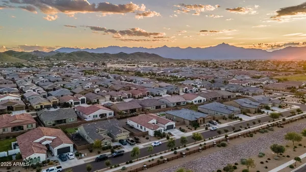 an aerial view of houses with outdoor space