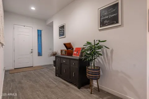 a couple of potted plants in front of door