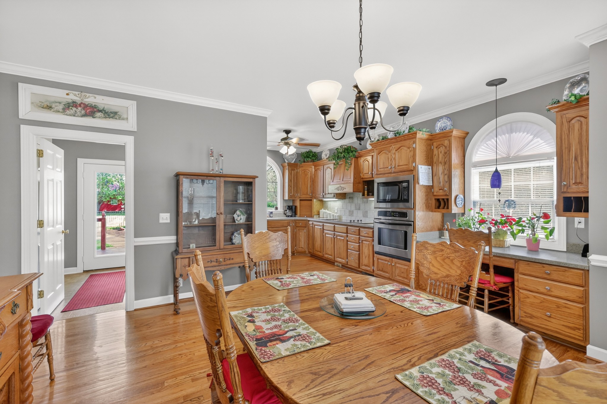 4676 Harpeth-Peytonsville Road Thompson's Station, TN 37179 - Photo 13 of 84 a living room with dining table and a chandelier