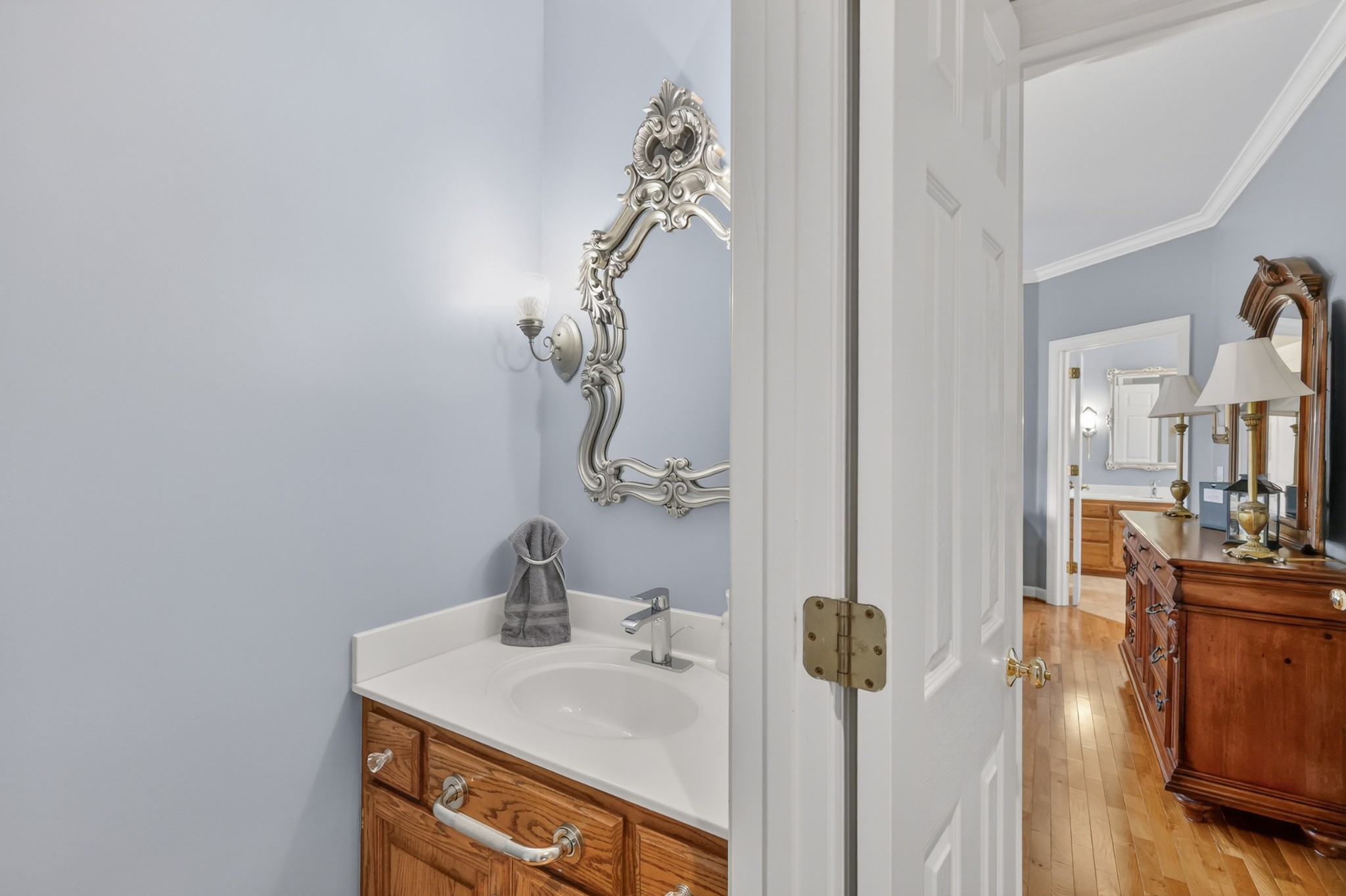 4676 Harpeth-Peytonsville Road Thompson's Station, TN 37179 - Photo 19 of 84 a bathroom with a sink a mirror and vanity