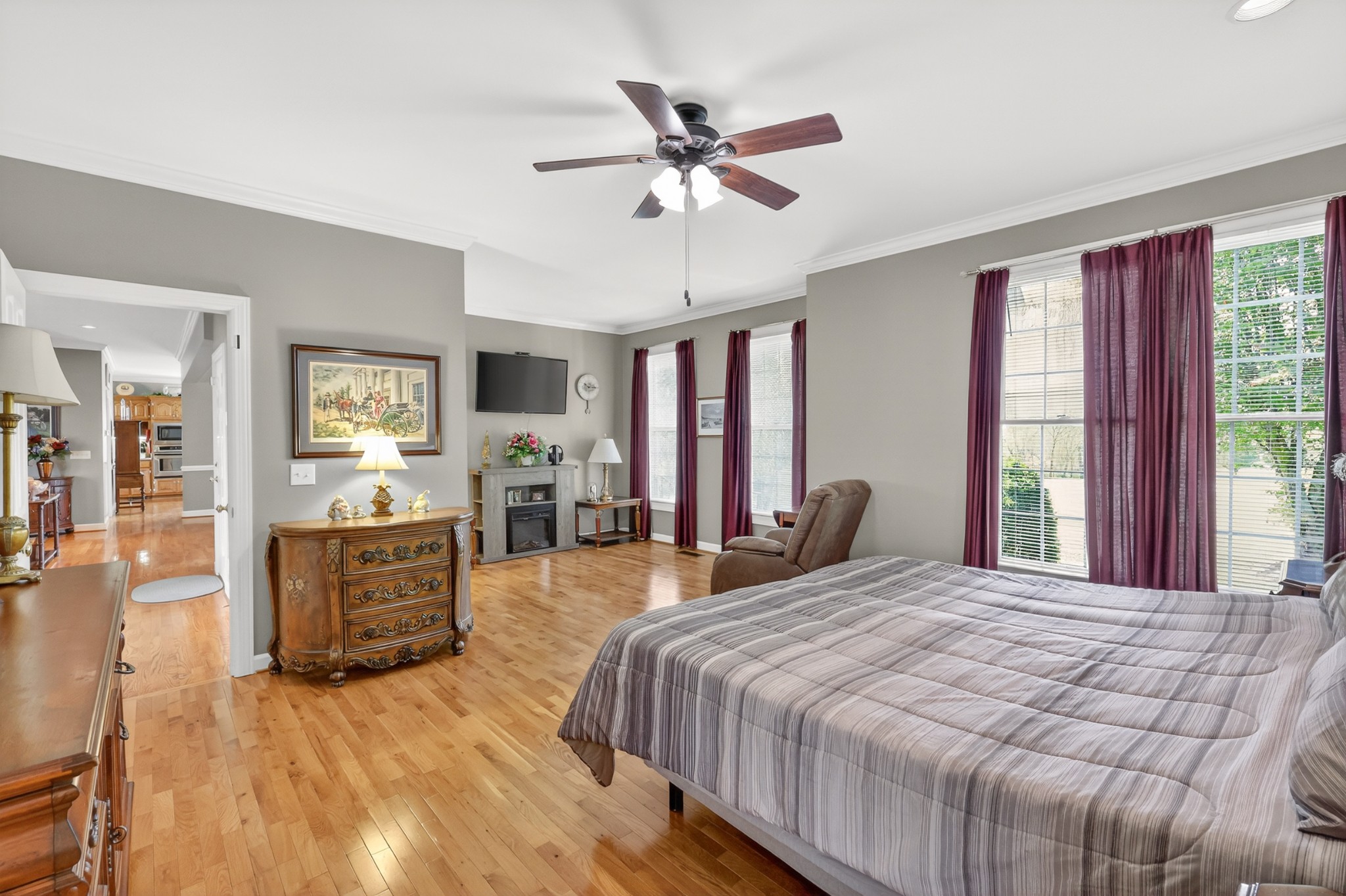 4676 Harpeth-Peytonsville Road Thompson's Station, TN 37179 - Photo 21 of 84 a bedroom with a large bed and a chandelier