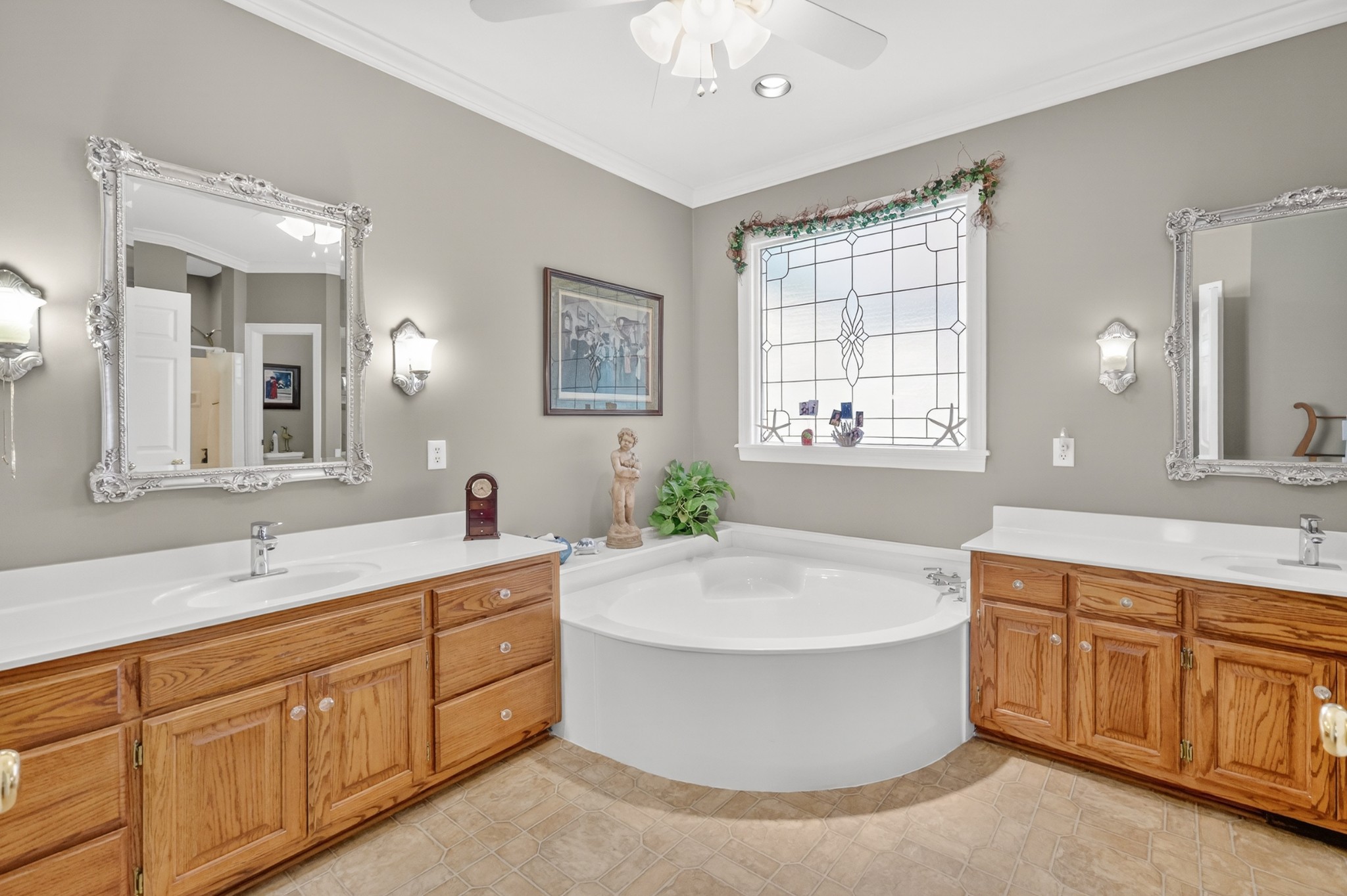 4676 Harpeth-Peytonsville Road Thompson's Station, TN 37179 - Photo 24 of 84 a spacious bathroom with a tub sink and mirror