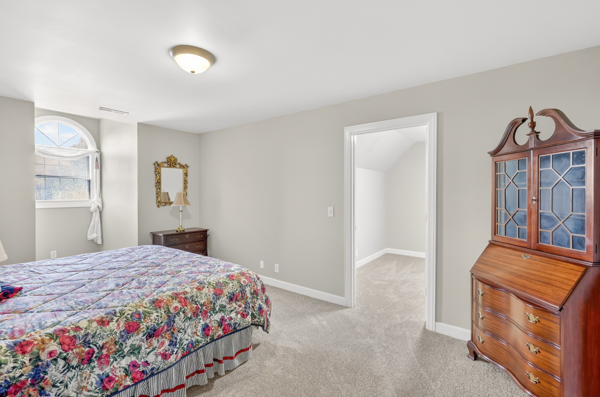 4676 Harpeth-Peytonsville Road Thompson's Station, TN 37179 - Photo 33 of 84 a bedroom with a bed and a dresser
