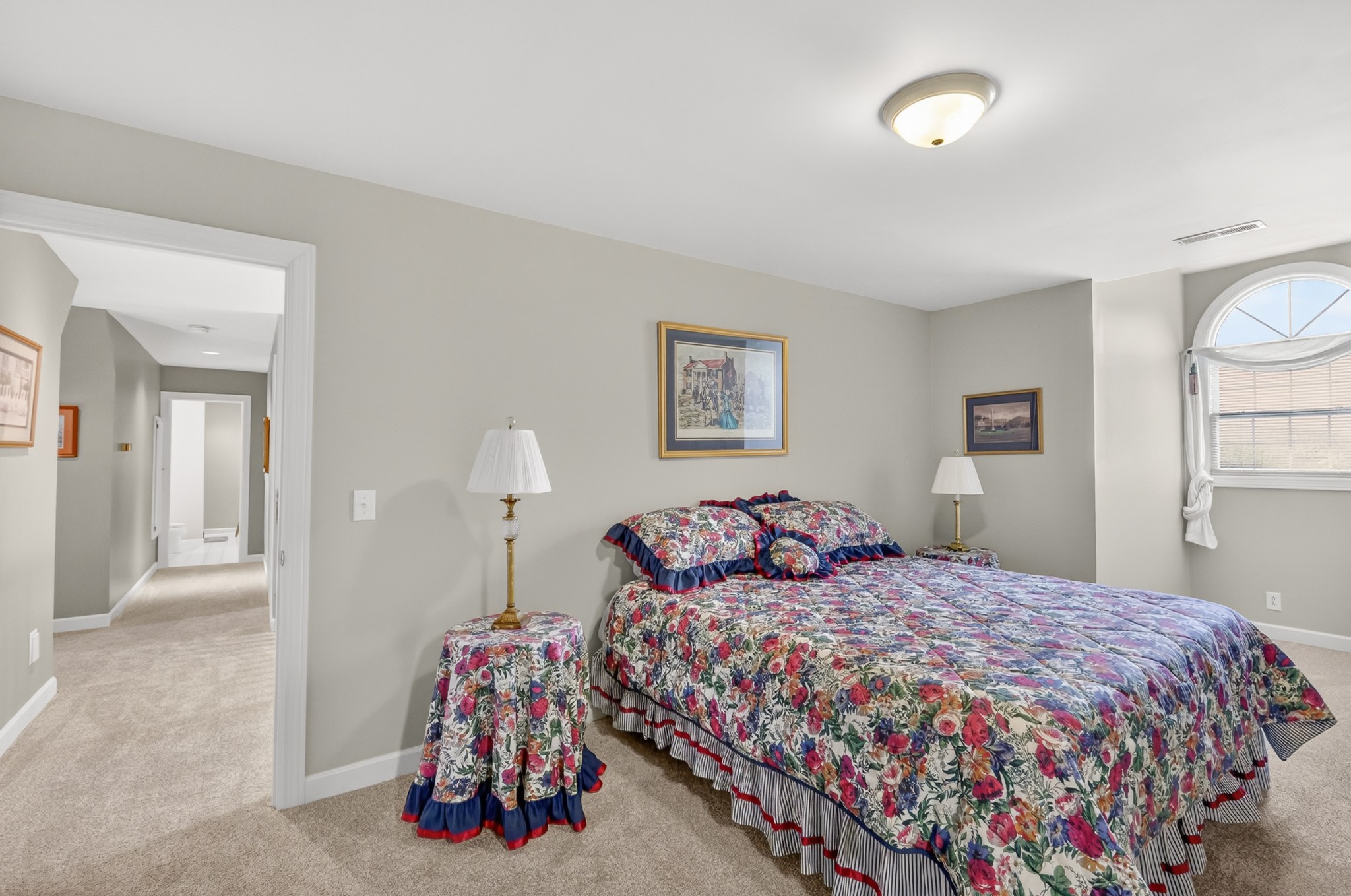 4676 Harpeth-Peytonsville Road Thompson's Station, TN 37179 - Photo 35 of 84 a bedroom with a bed and a chandelier