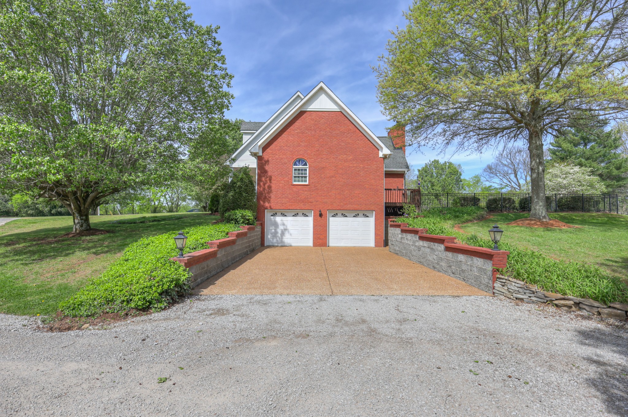 4676 Harpeth-Peytonsville Road Thompson's Station, TN 37179 - Photo 42 of 84 a front view of a house with a yard and garage