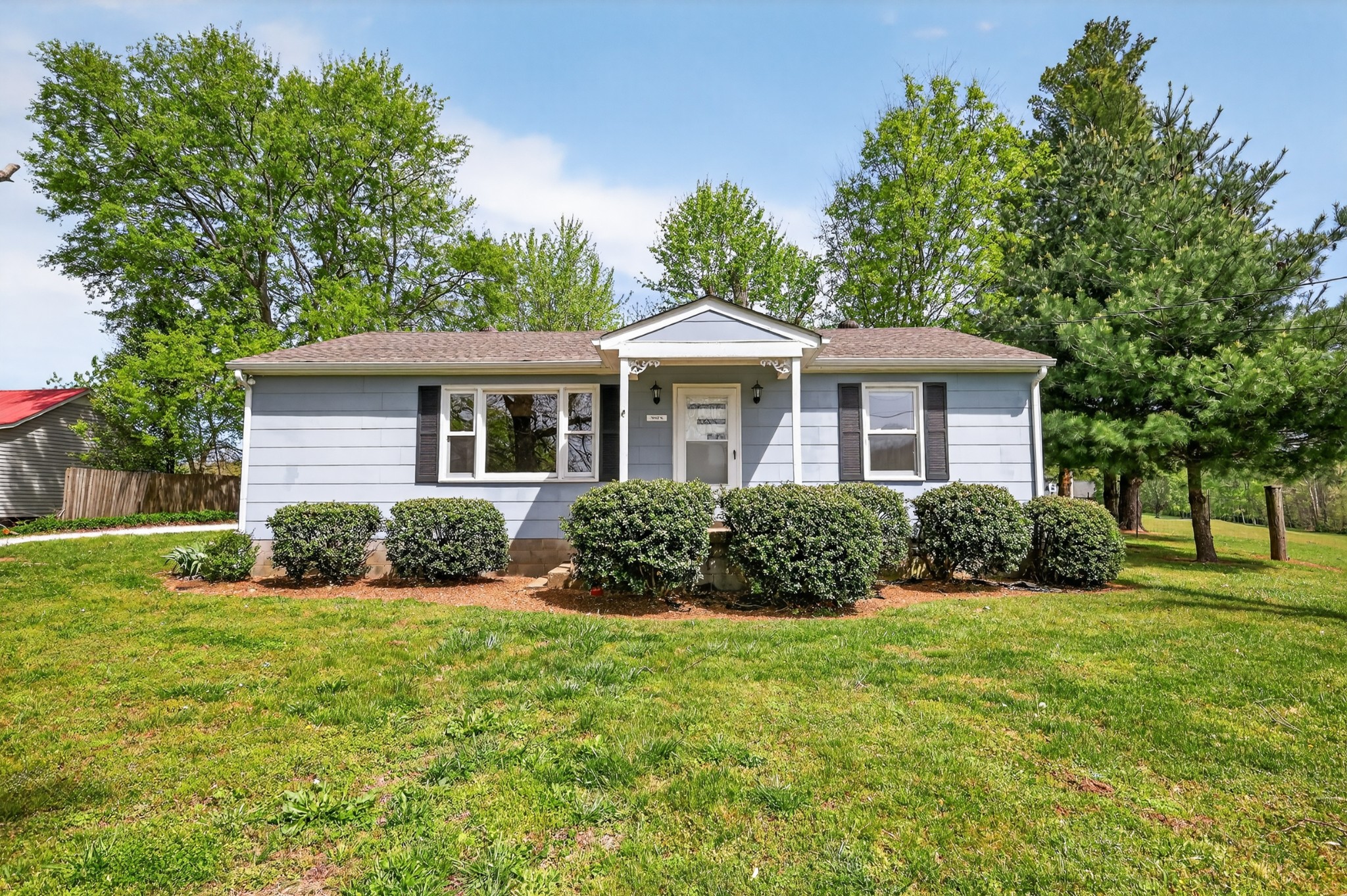 4676 Harpeth-Peytonsville Road Thompson's Station, TN 37179 - Photo 48 of 84 a front view of a house with a yard