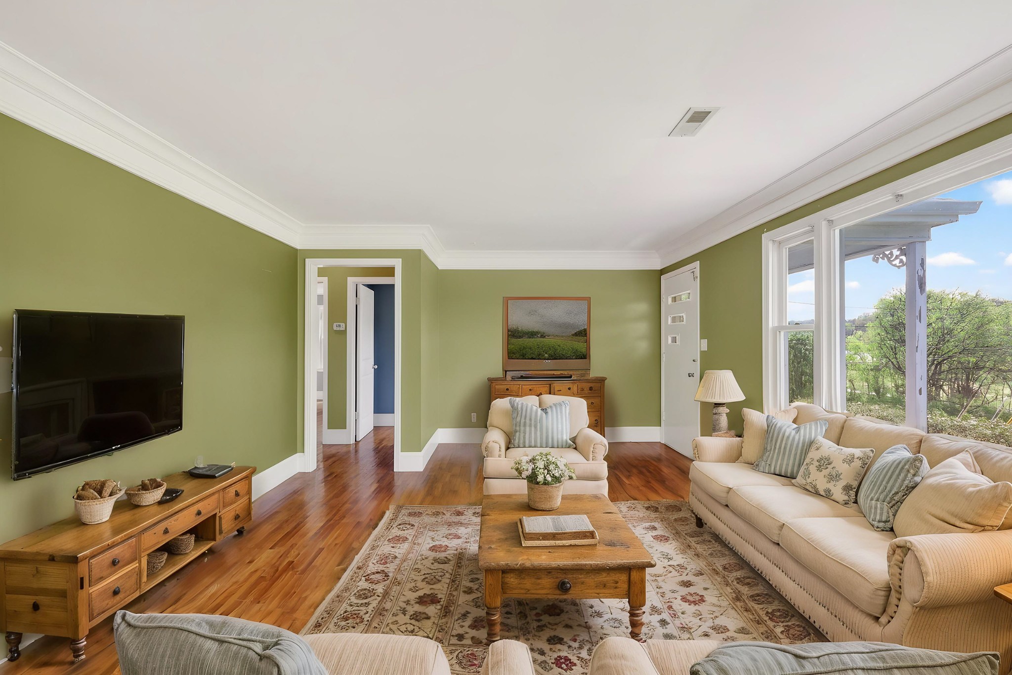 4676 Harpeth-Peytonsville Road Thompson's Station, TN 37179 - Photo 56 of 84 a living room with furniture and a flat screen tv