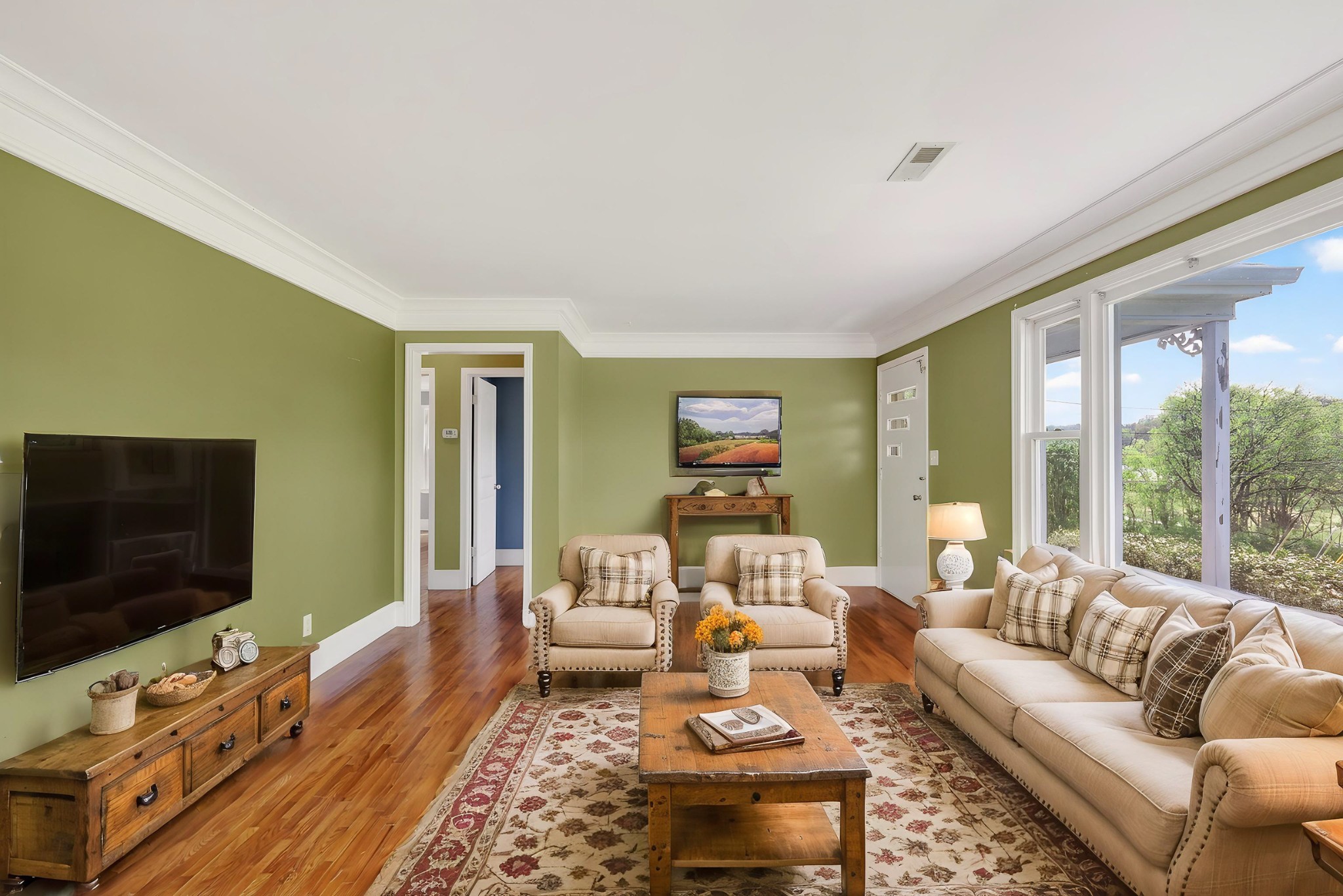 4676 Harpeth-Peytonsville Road Thompson's Station, TN 37179 - Photo 57 of 84 a living room with furniture and a flat screen tv