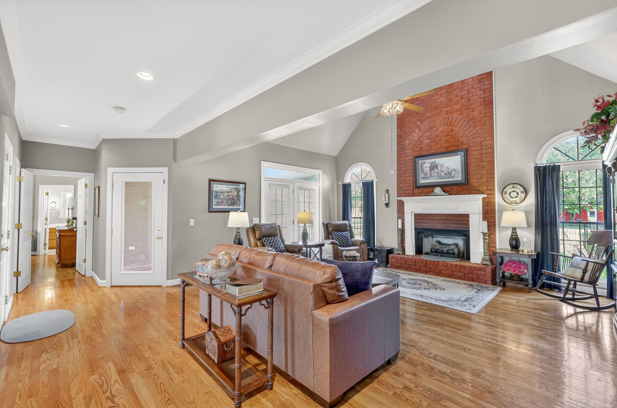 4676 Harpeth-Peytonsville Road Thompson's Station, TN 37179 - Photo 7 of 84 a living room with fireplace furniture and a wooden floor