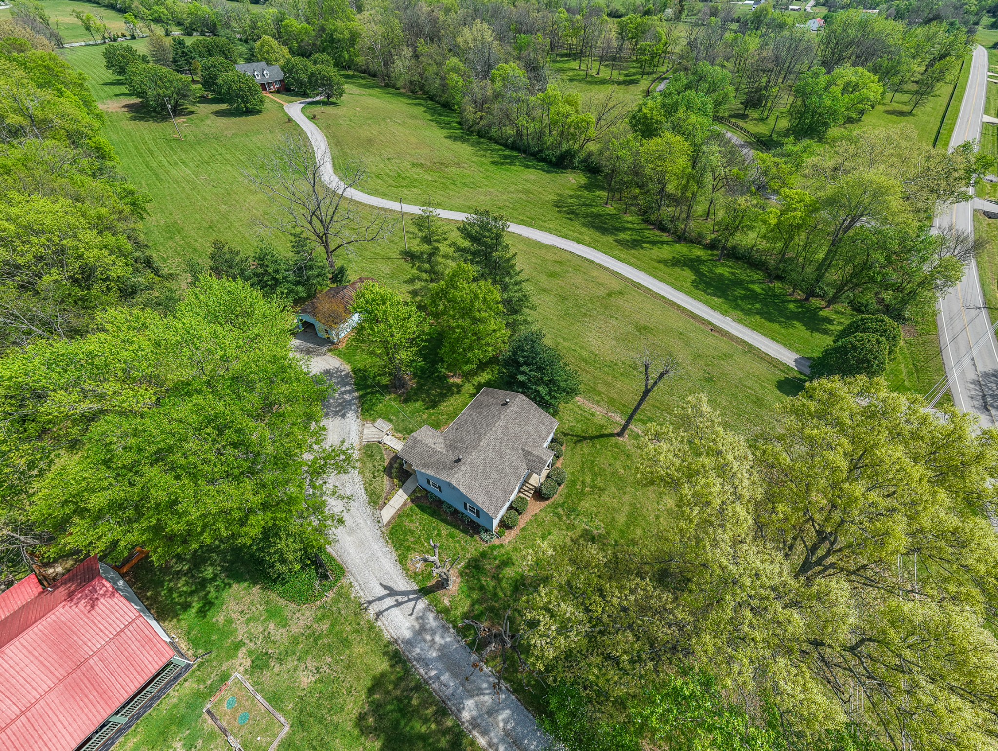 4676 Harpeth-Peytonsville Road Thompson's Station, TN 37179 - Photo 82 of 84 a view of a house with a yard
