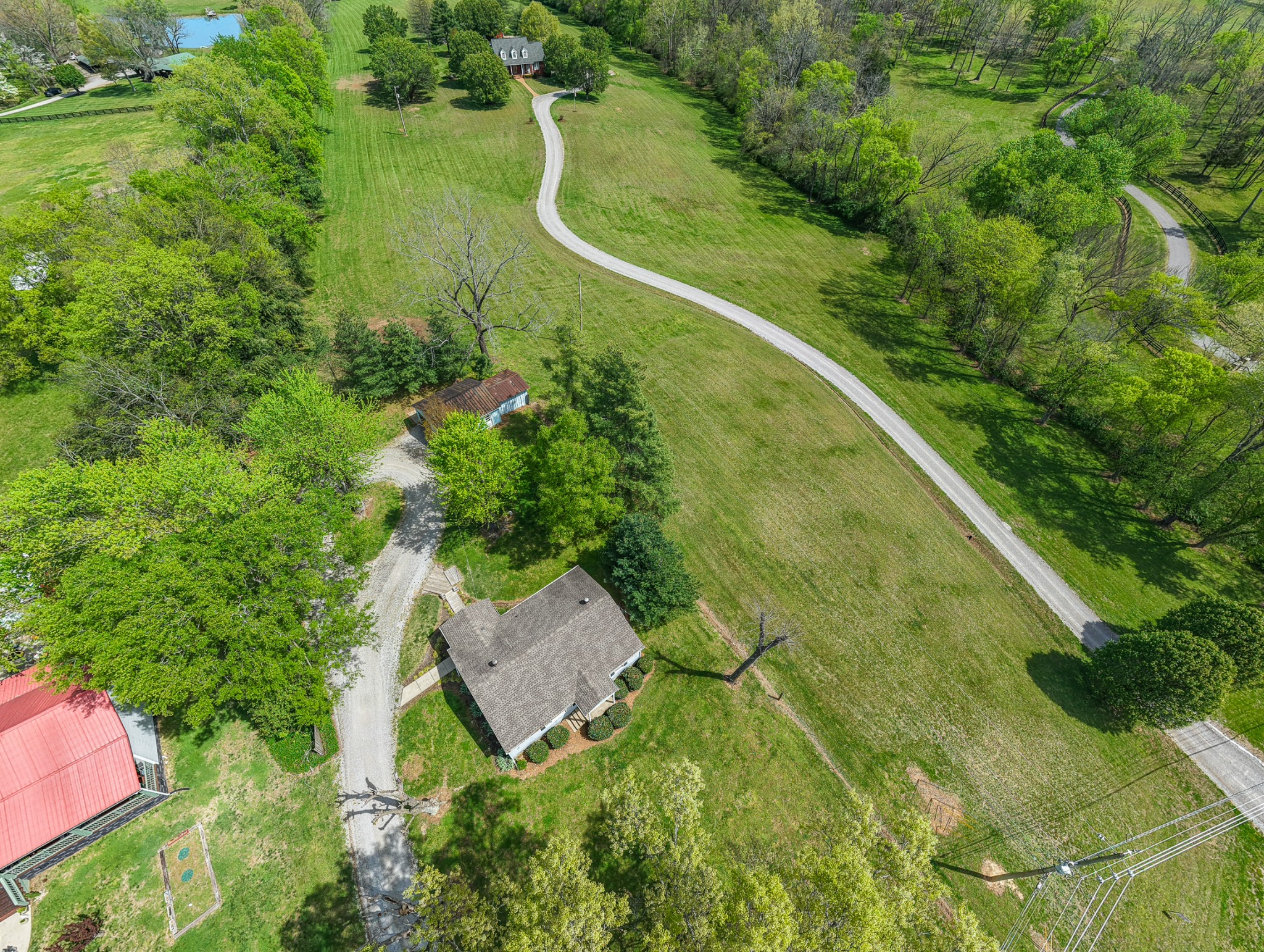 4676 Harpeth-Peytonsville Road Thompson's Station, TN 37179 - Photo 84 of 84 an aerial view of a residential houses with outdoor space and trees all around