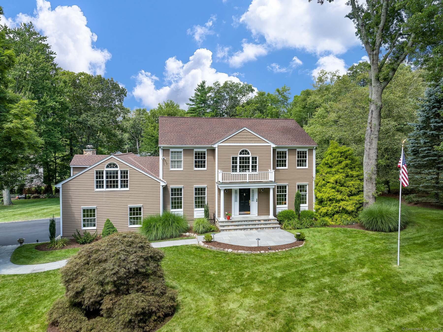 8 Leeds Lane Darien, CT 06820 - Photo 1 of 1 a front view of a house with a yard