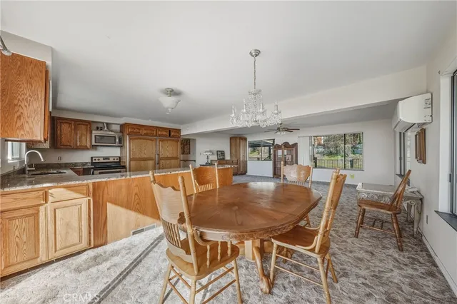 a bathroom with a tub a sink and a large mirror