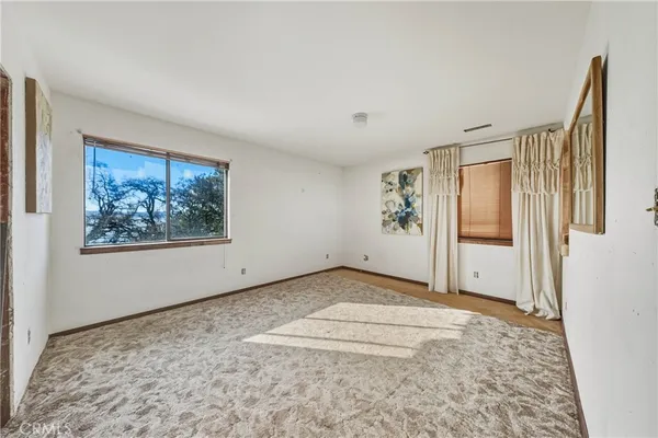 a spacious bathroom with a sink mirror and a bath tub